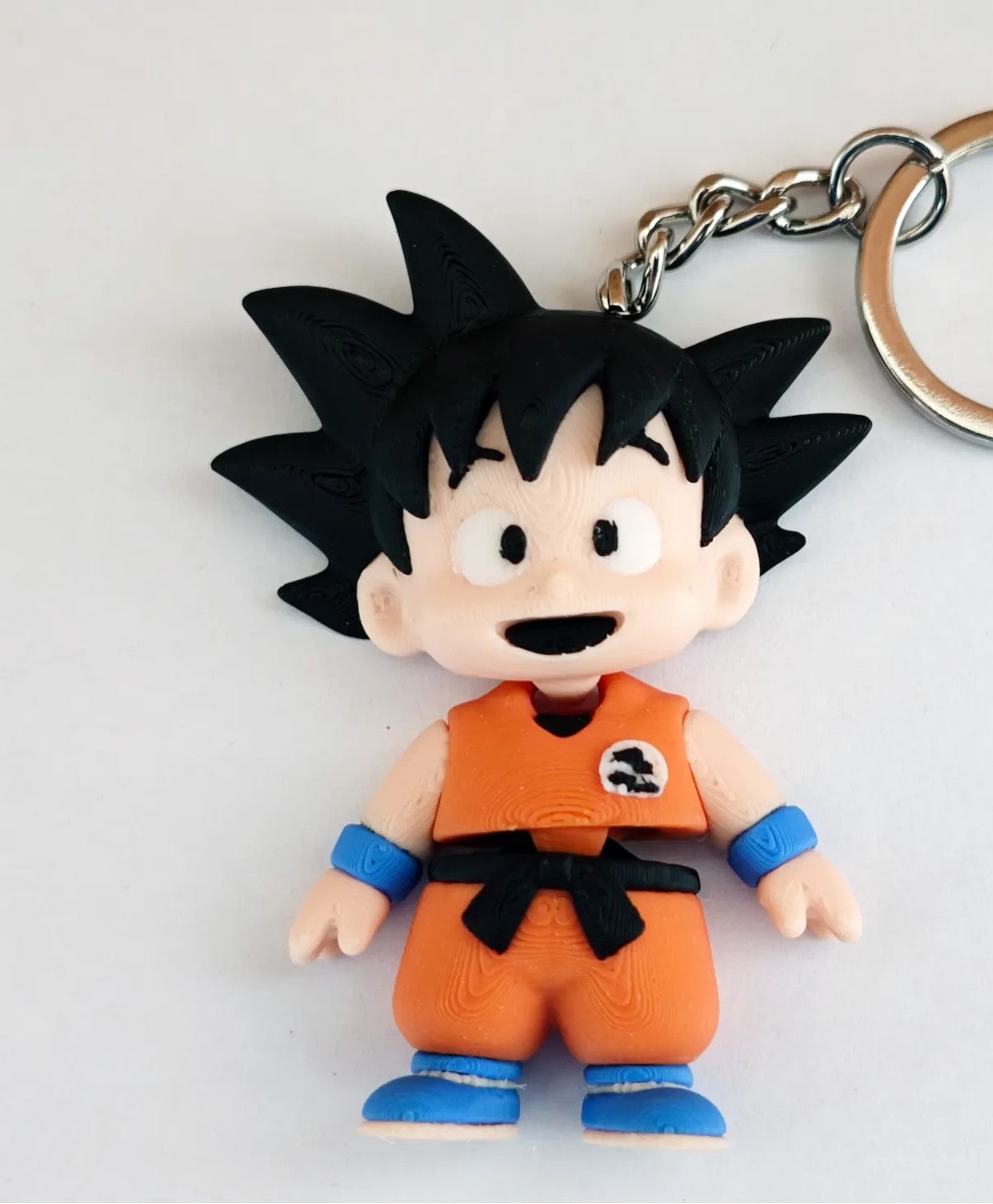 Articulated Goku Minifigure Collectible Keychain.