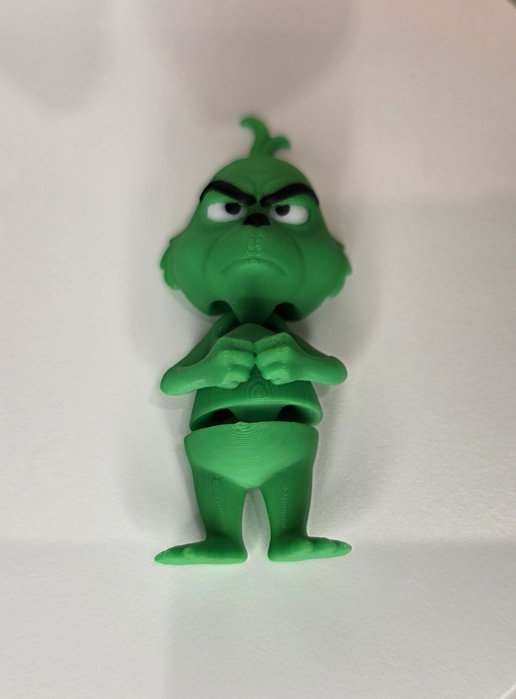 Articulated Grinch Minifigure Collectible Keychain.