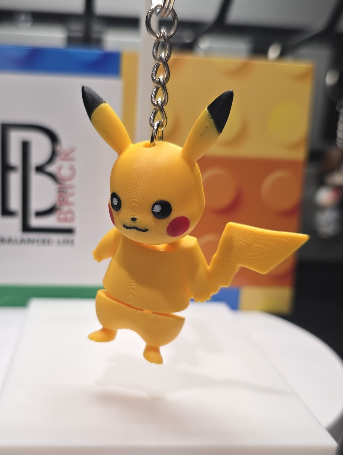 Articulated Pikachu Minifigure Collectible Keychain.
