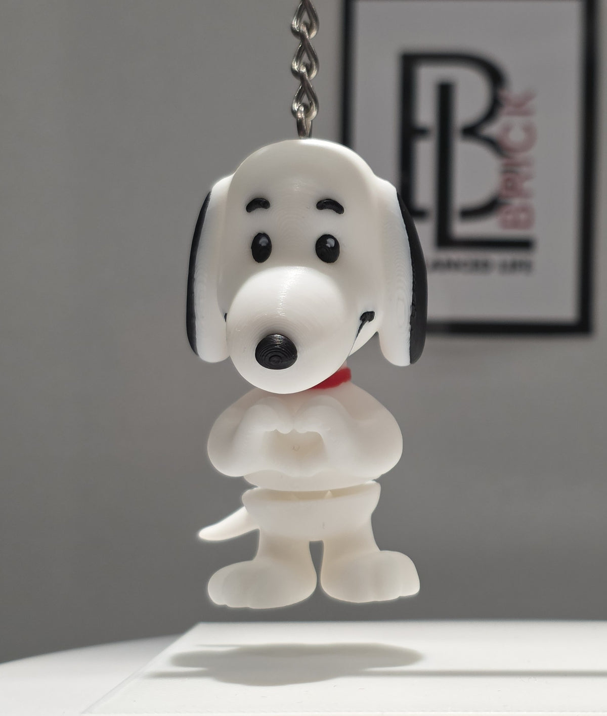 Articulated Snoopy Minifigure Collectible Keychain.