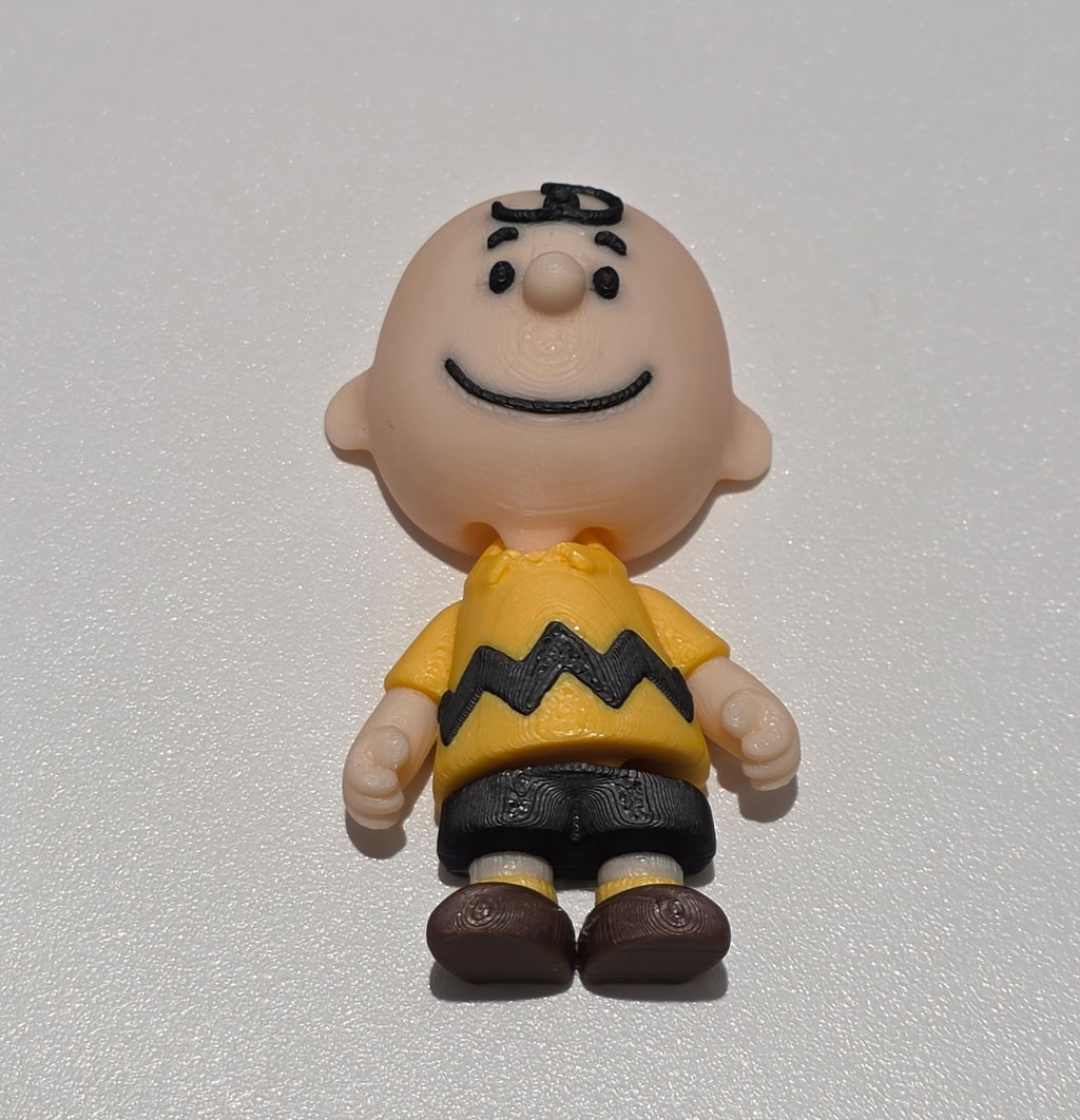 Articulated Charlie Brown Minifigure Collectible Keychain.