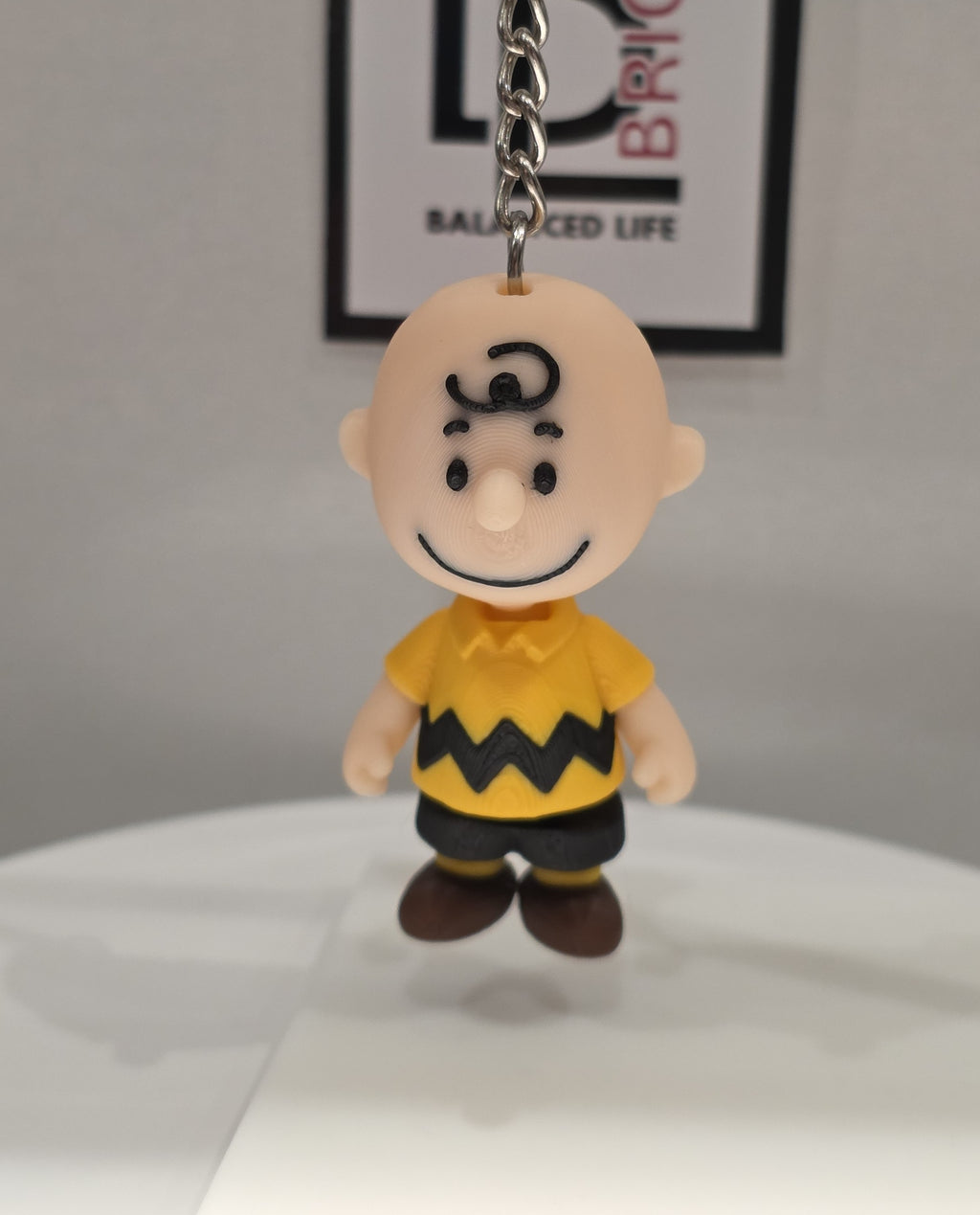 Articulated Charlie Brown Minifigure Collectible Keychain.