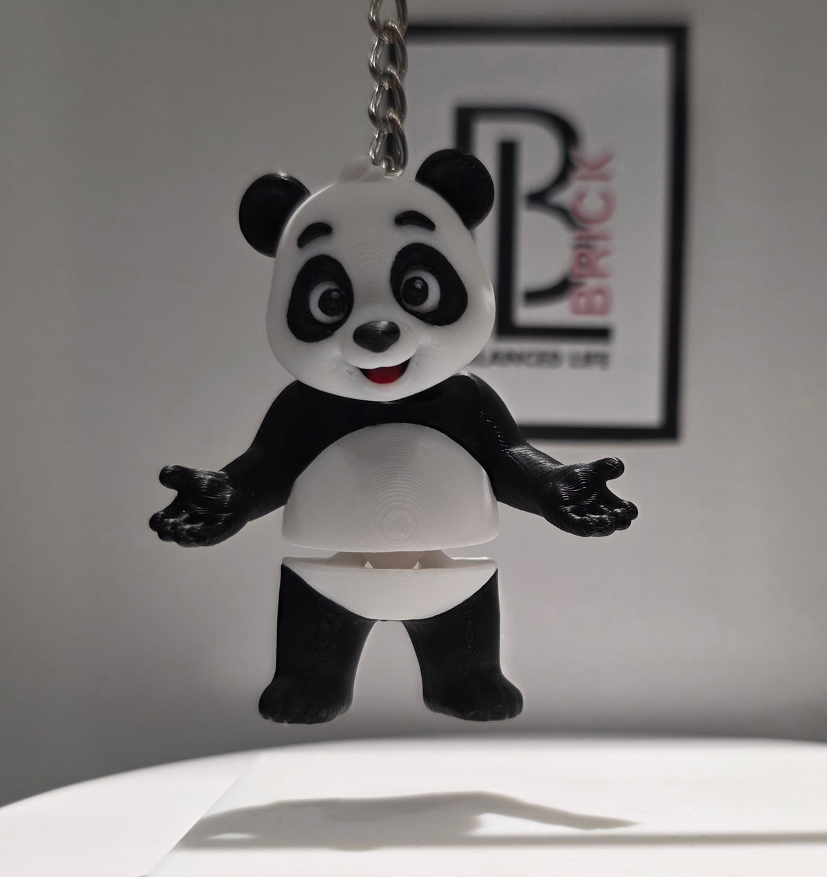 Articulated Panda Bear Minifigure Collectible Keychain.