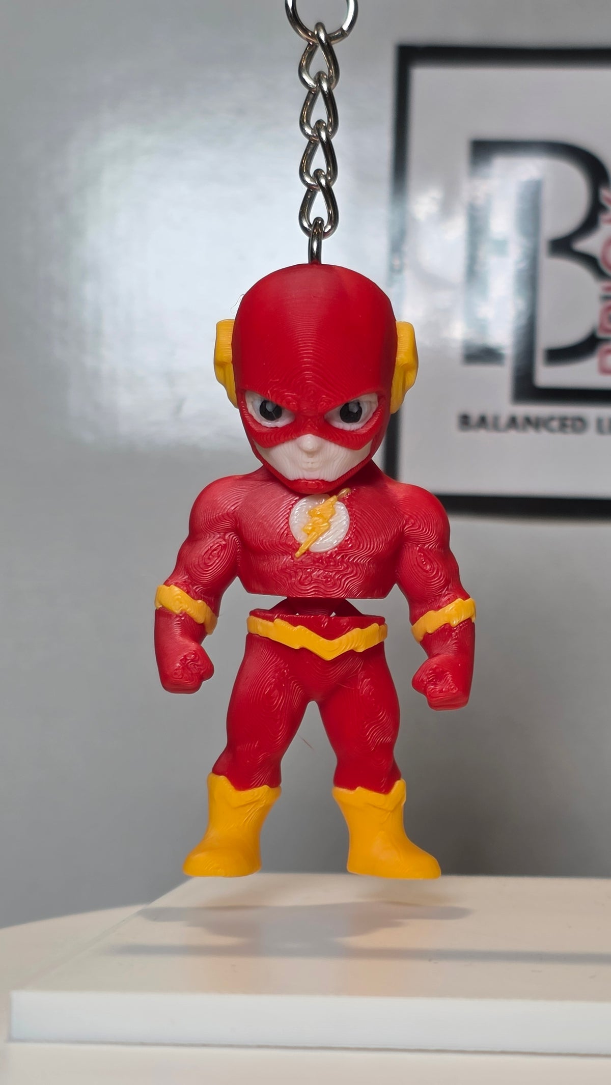 Articulated Flash Minifigure Collectible Keychain.