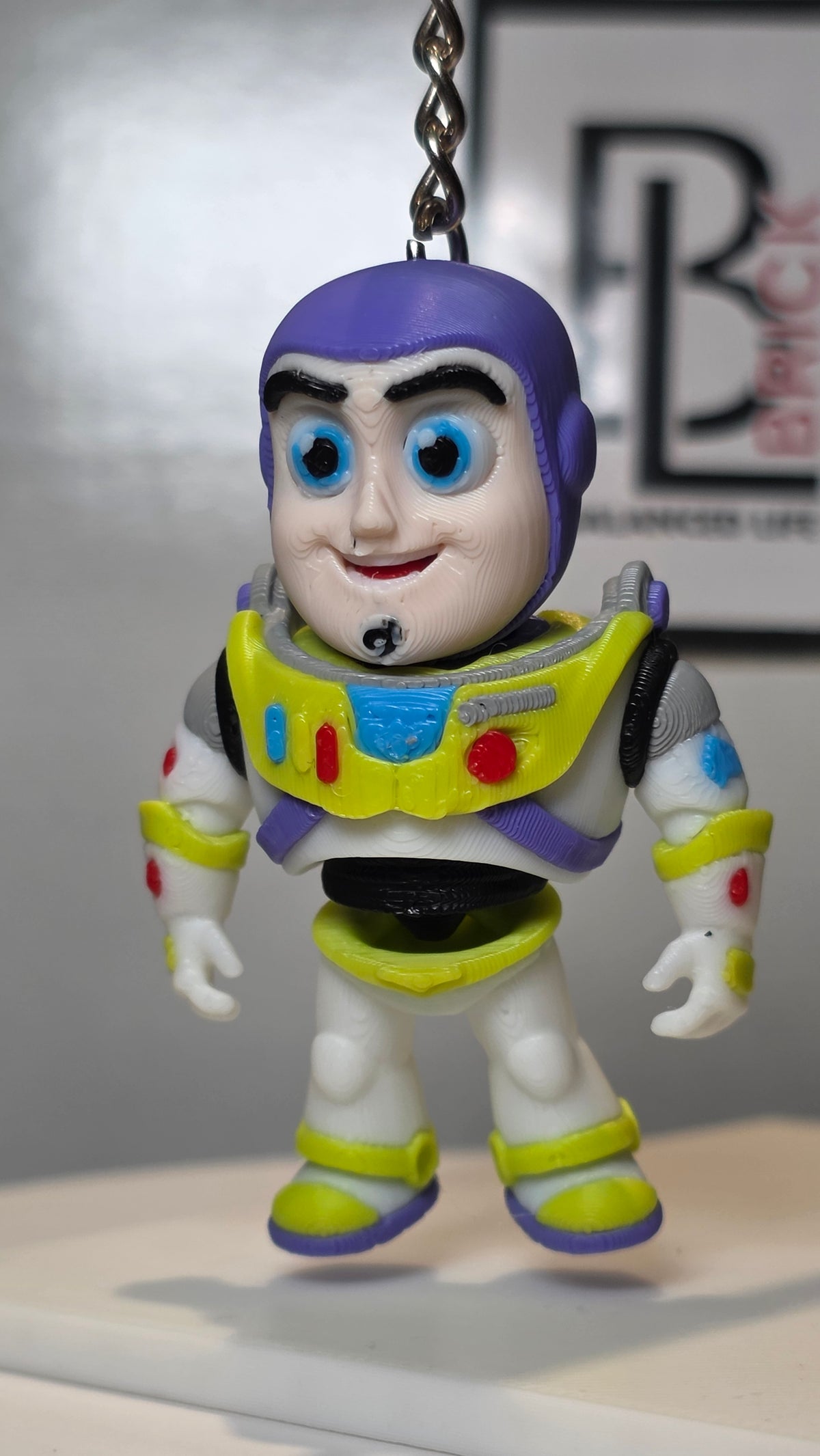 Articulated Buzz Lightyear Minifigure Collectible Keychain.