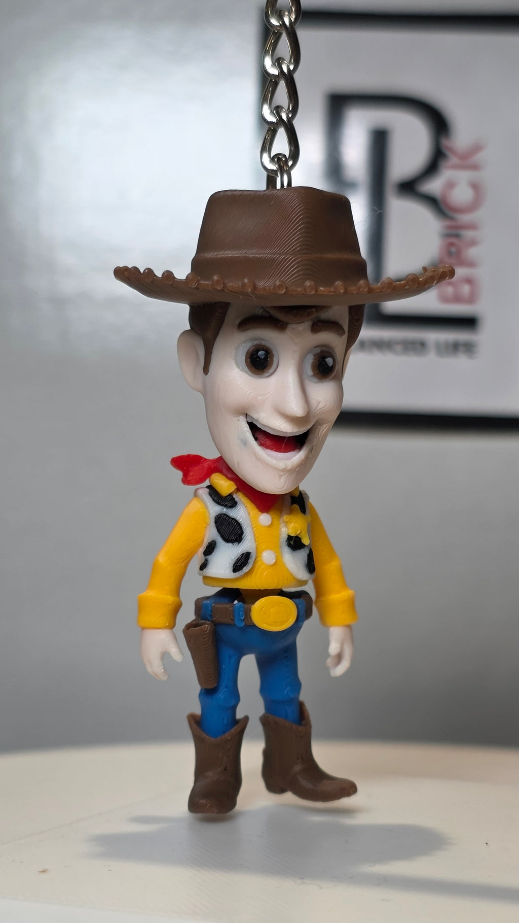 Articulated Woody Minifigure Collectible Keychain.