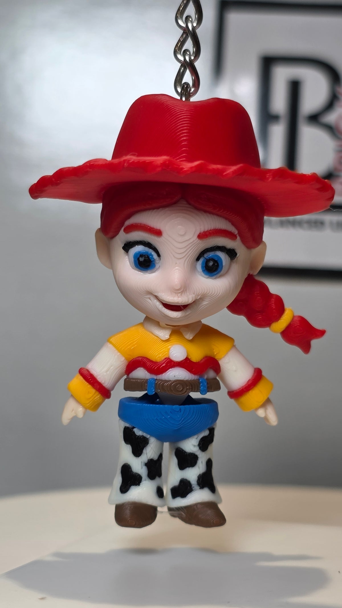 Articulated Jessie Minifigure Collectible Keychain.