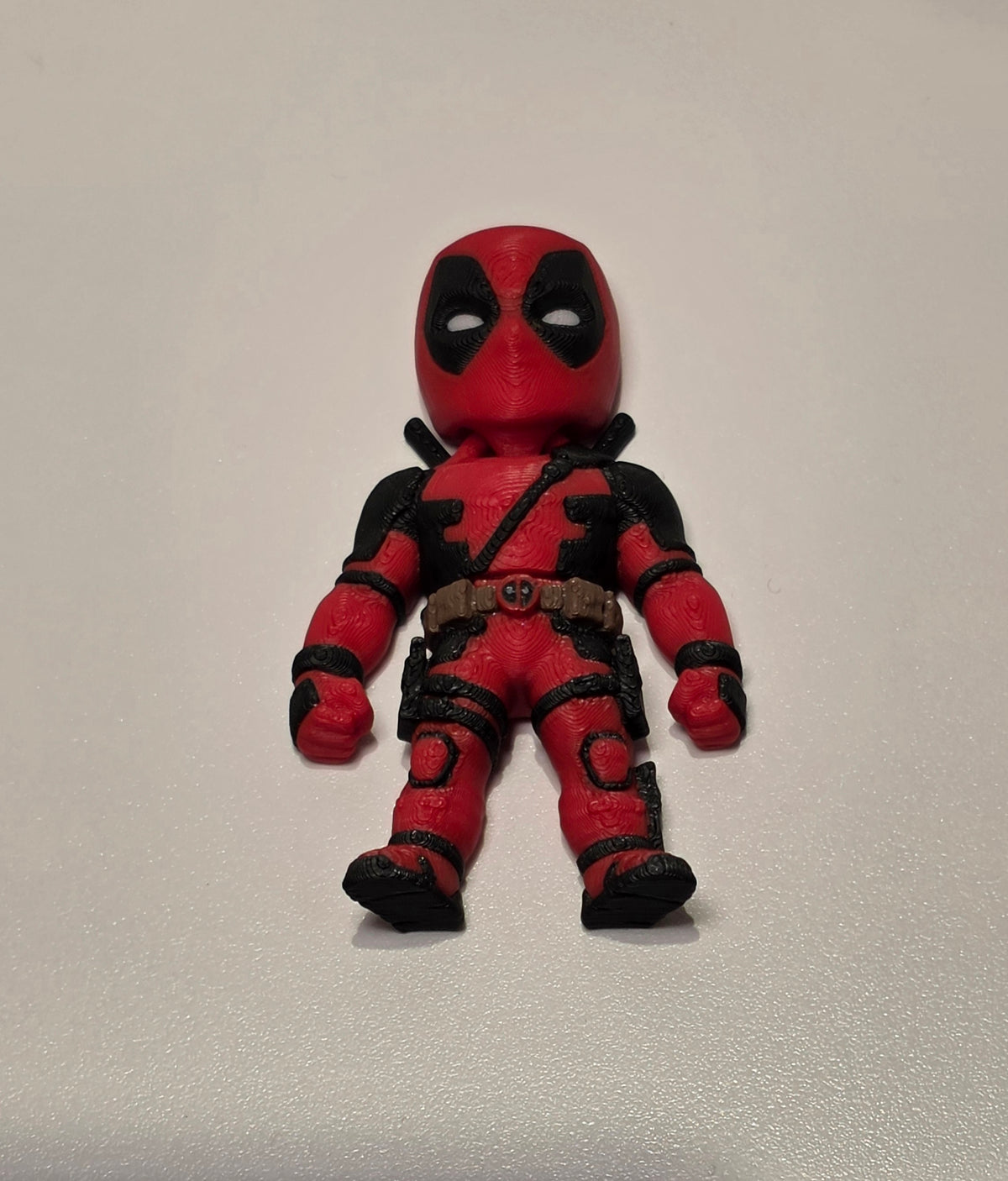 Articulated Deadpool Minifigure Collectible Keychain.