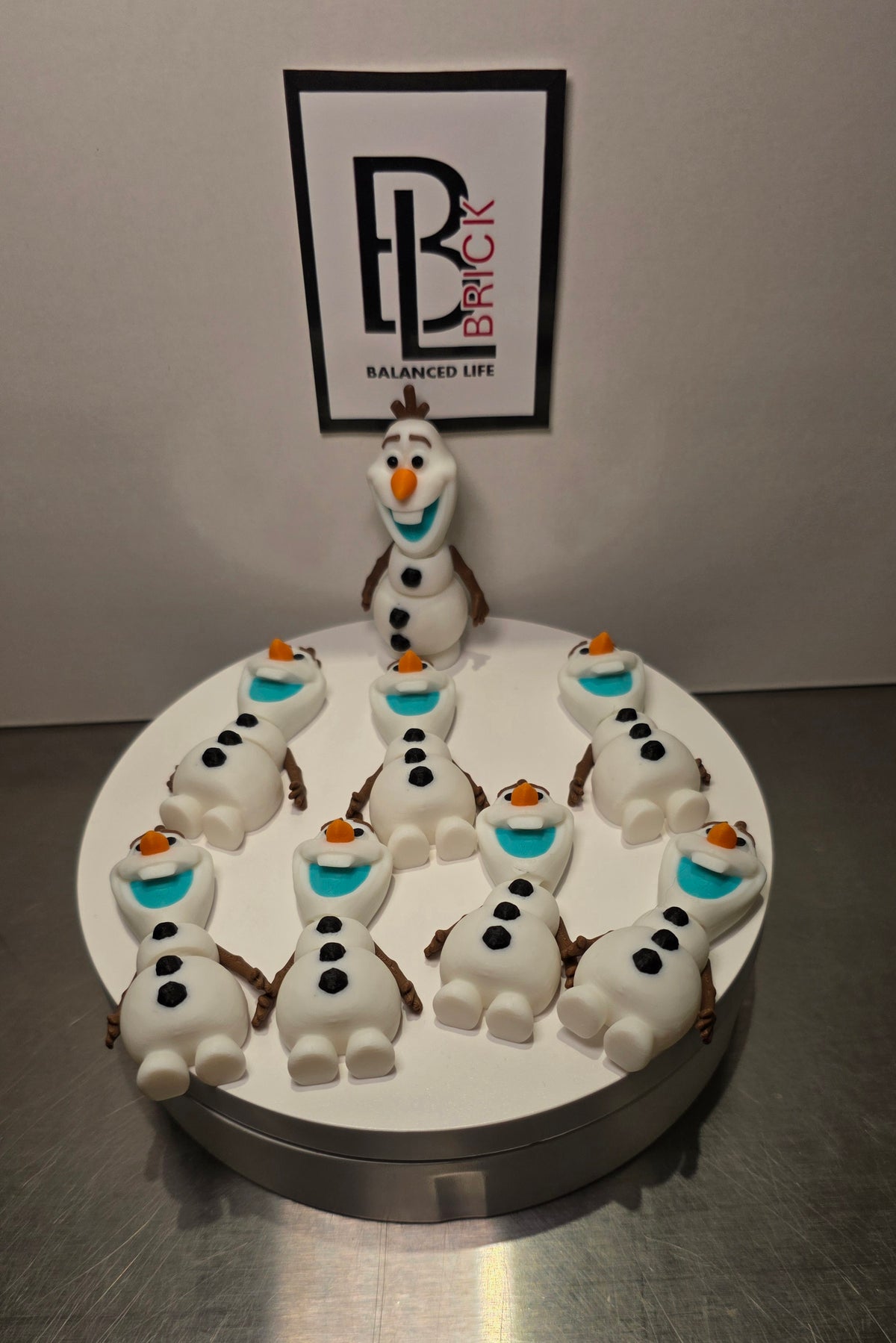 Articulated Olaf Bell Minifigure Collectible Keychain.