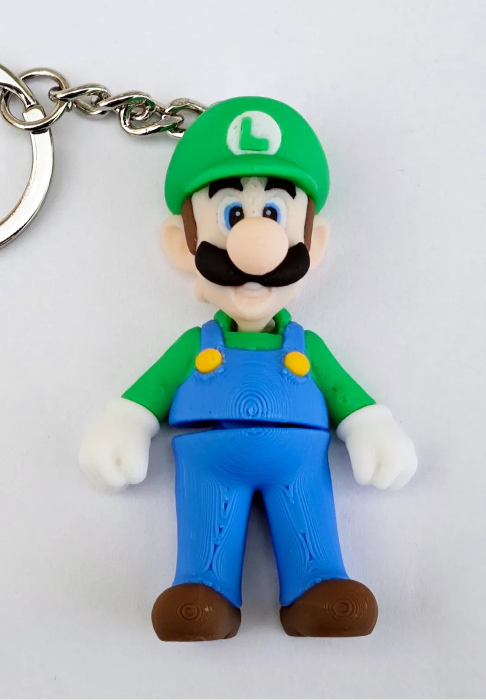 Articulated Luigi Minifigure Collectible Keychain.