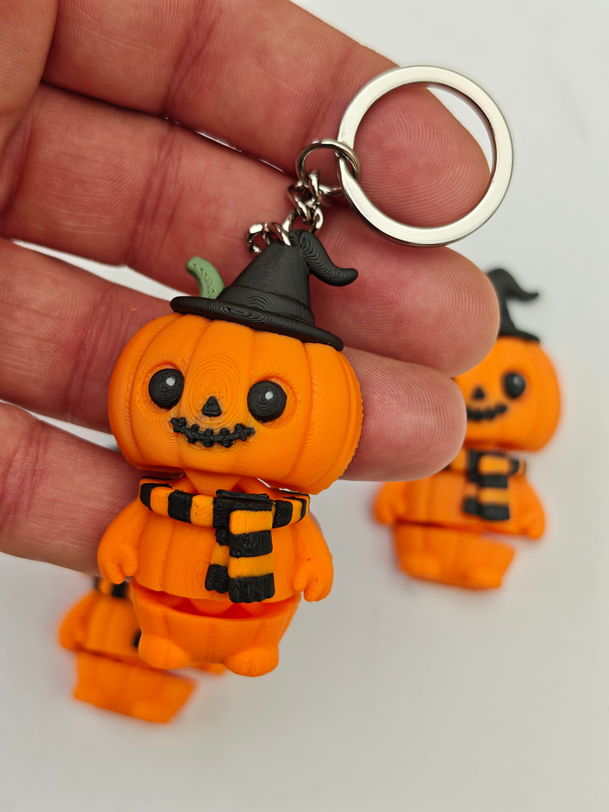 Articulated Halloween Pumpkin Minifigure Collectible Keychain.