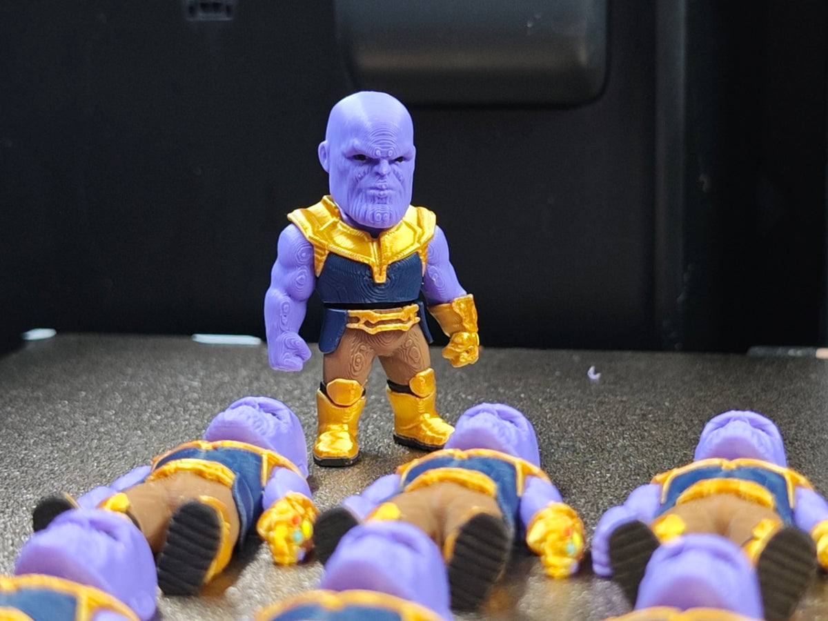 Articulated Thanos Minifigure Collectible Keychain.
