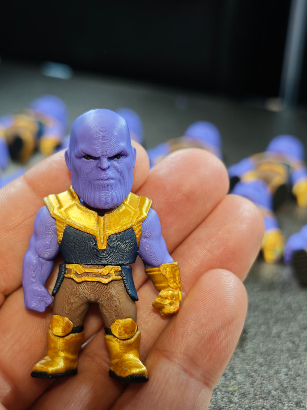 Articulated Thanos Minifigure Collectible Keychain.