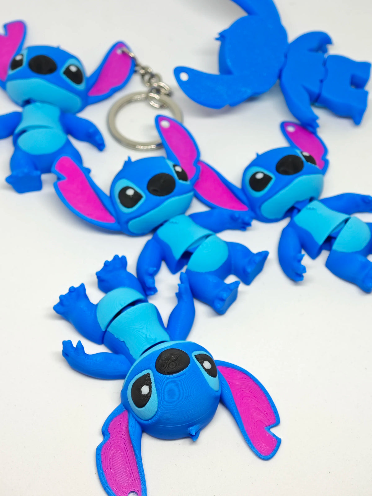 Articulated Stitch Minifigure Collectible Keychain.