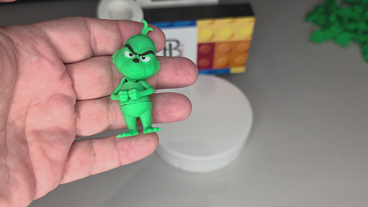 Articulated Grinch Minifigure Collectible Keychain.